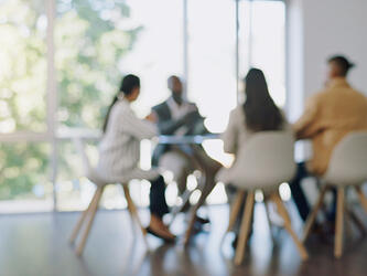 Blurred meeting business conversations meeting room professionals jun26_crop